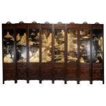 A Chinese eight-panel screen carved in relief with inserted gilt-lacquer painted panels depicting