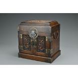 A Chinese hardwood seal chest. Of rectangular form carved in relief with dragons and clouds. Top-