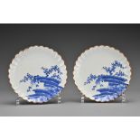 A pair of Japanese Kakiemon blue and white lobbed porcelain dishes. Each dish decorated in