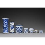 A group of seven Chinese 19th Century blue and white porcelain items. To include a Gu shaped vase