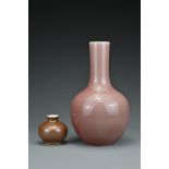 A Chinese monochrome peachbloom-glazed porcelain bottle vase with six-character mark of Daoguang.