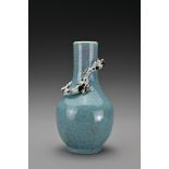 A Chinese 19th Century 'robin's egg'-glazed porcelain bottle vase with a moulded chilong around