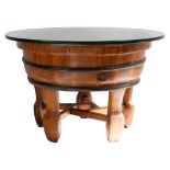 A Chinese wooden wash basin with metal bands and glass top. Standing on five legs with a stretcher
