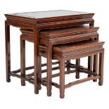 A Chinese hardwood nest of three side tables with stretcher legs. Largest table height 56 x width 61