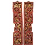 A pair of Chinese carved gilt-lacquer wall hangings depicting figures and animals with pierced