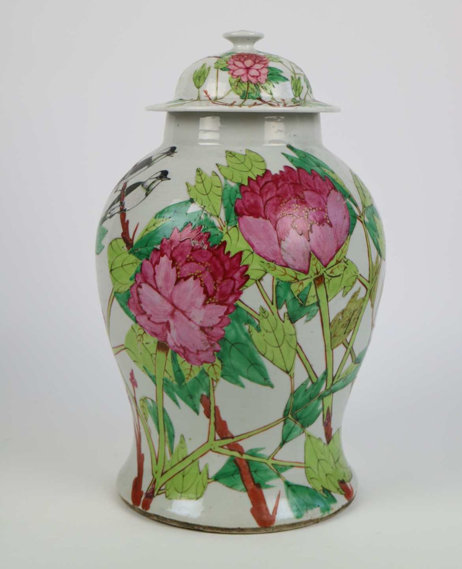 A Chinese vase with floral design and cover