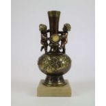 Bronze vase with putti
