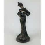 Elegant lady in bronze
