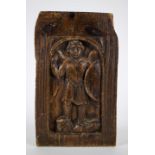 Sculpted angel in a wooden panel