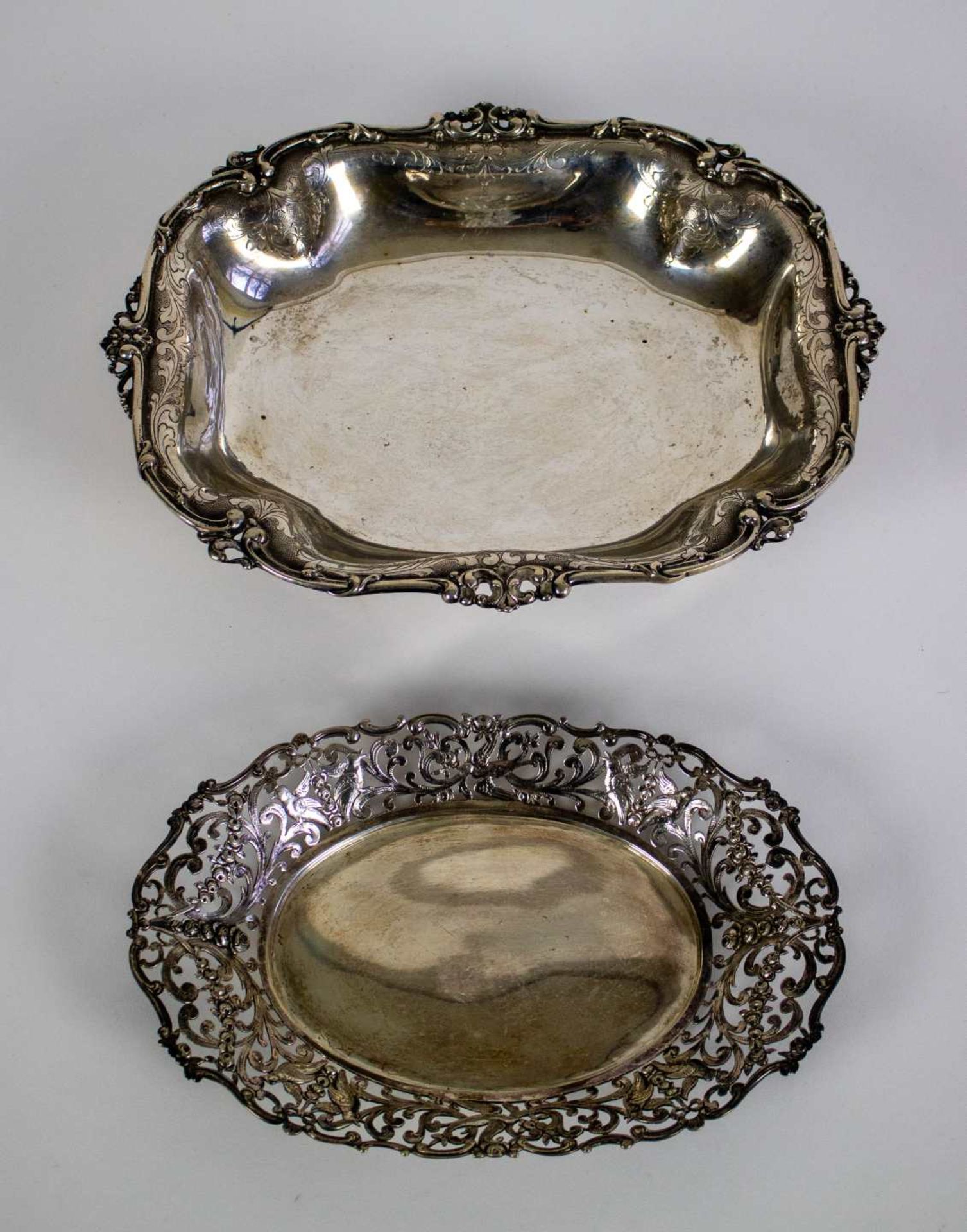 A silver bread basket and silver tray