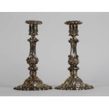 A Pair of silver candlesticks