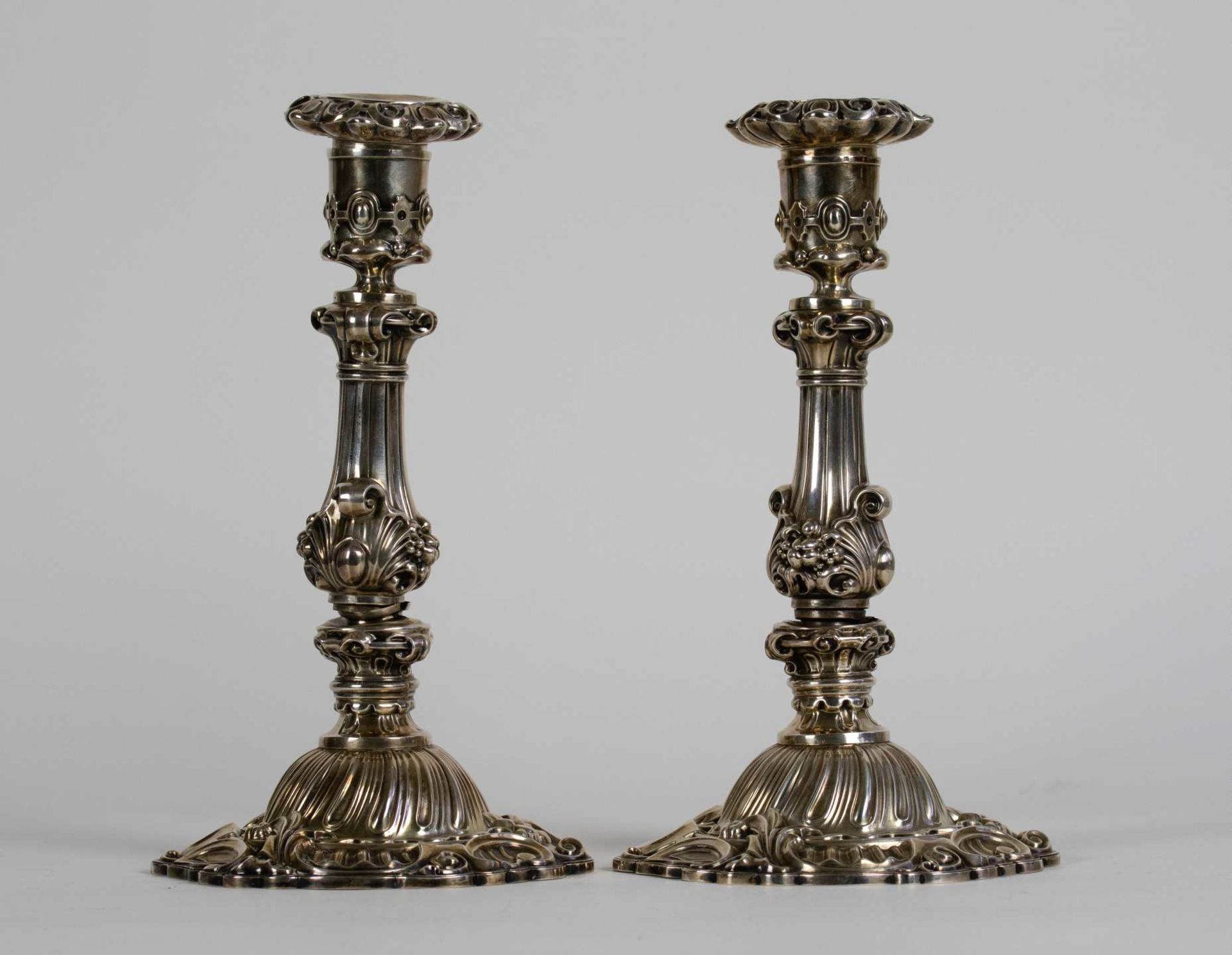 A Pair of silver candlesticks