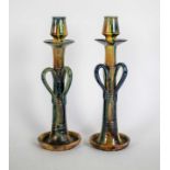 A pair of Flemish earthware candlesticks
