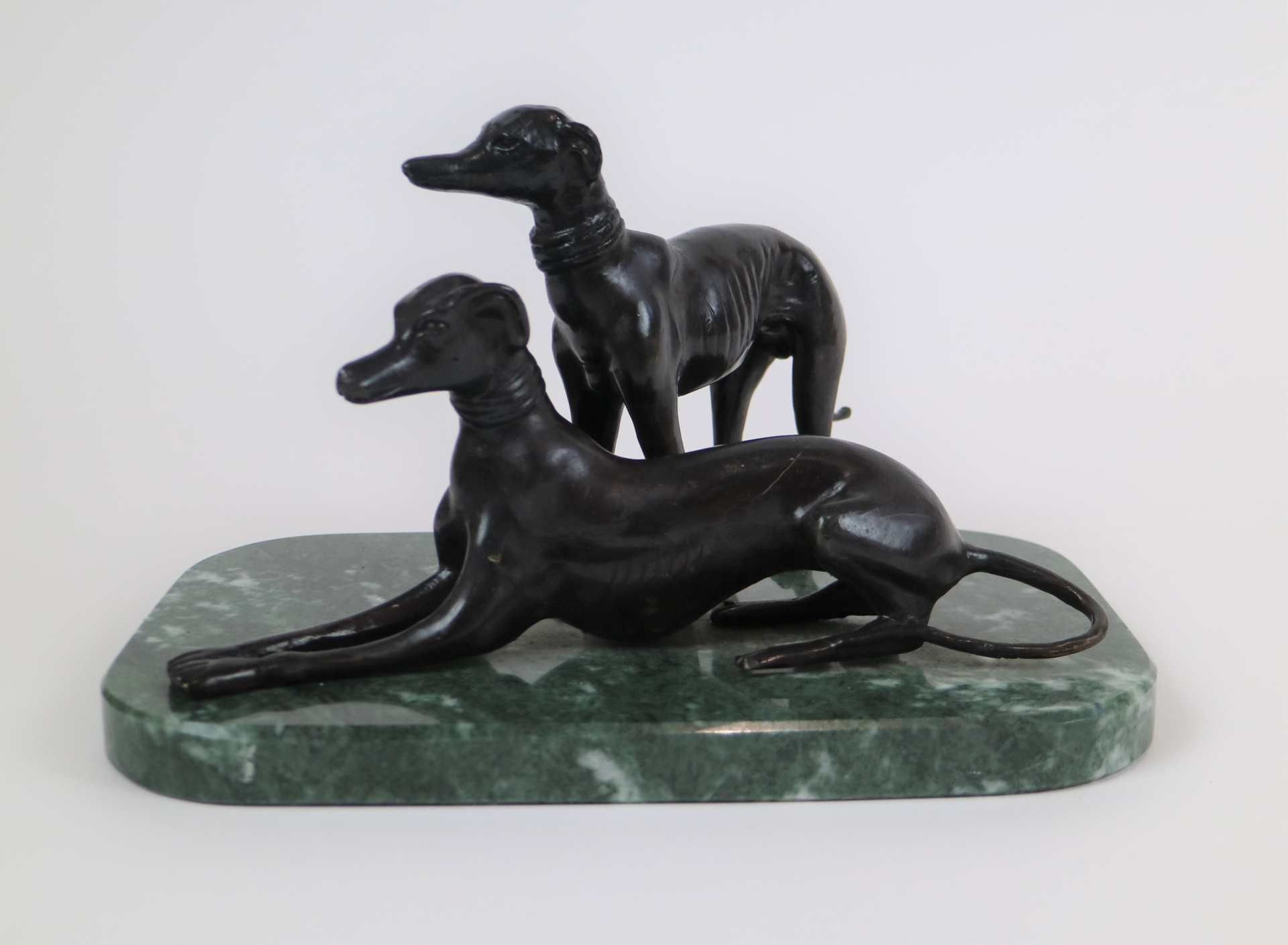 Bronze greyhounds on marble base