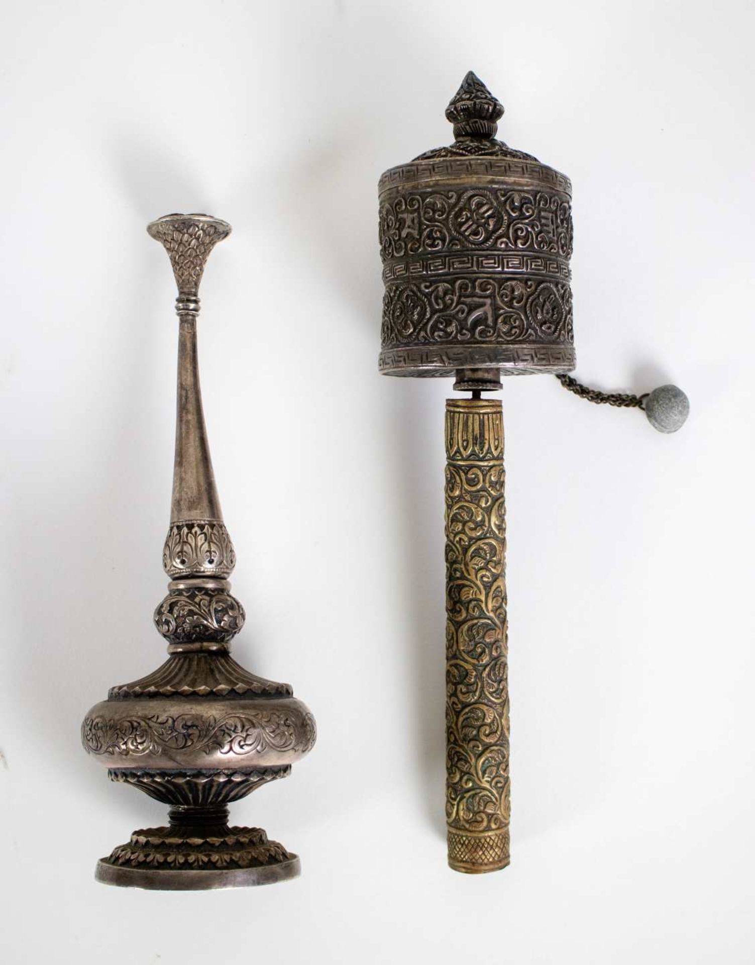 Silver rose water bottle and Tibetan prayer wheel
