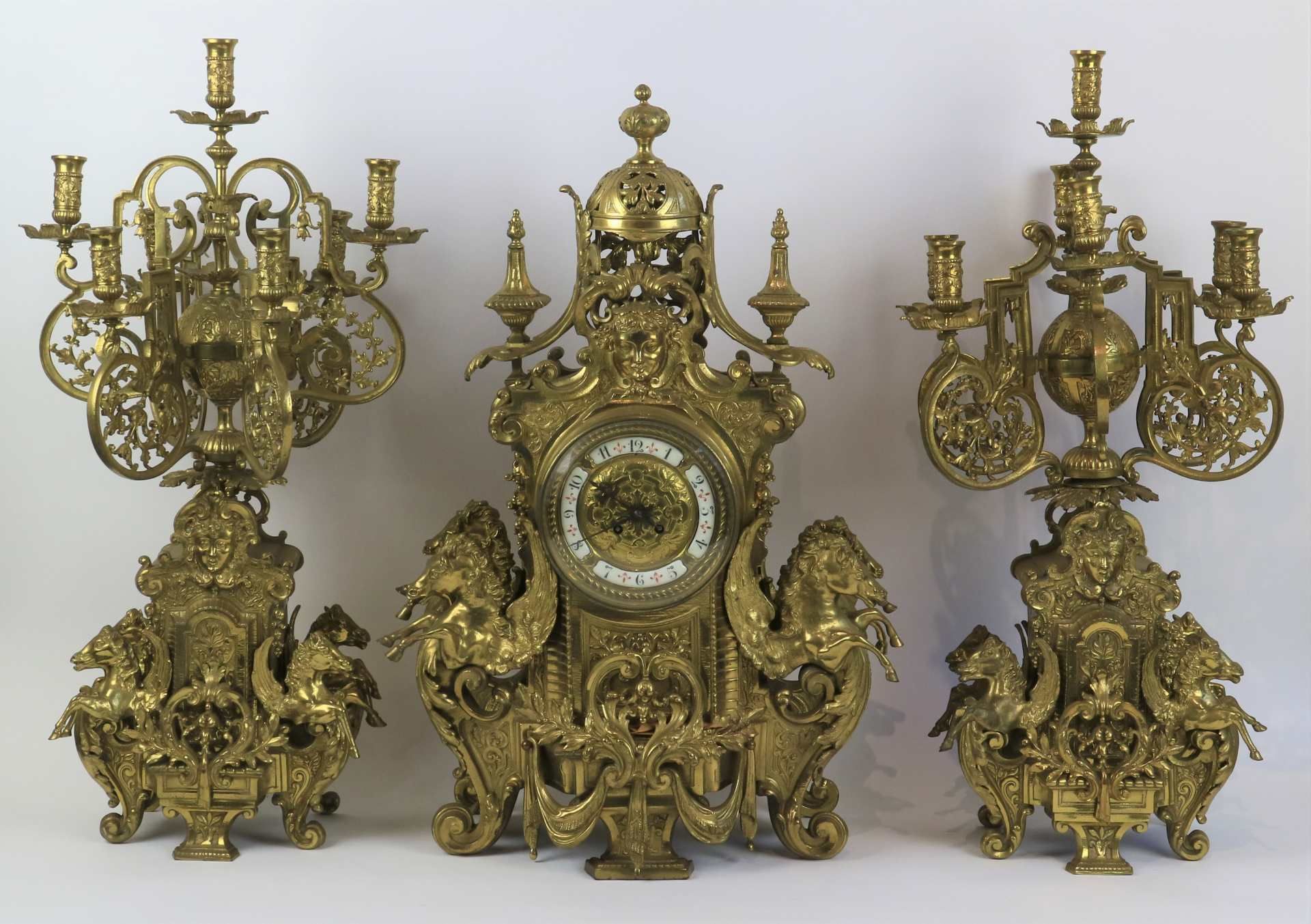 An imposing ormolu mantelpiece with candlesticks