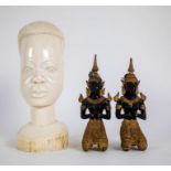 Thai temple guardians and Ivory African head