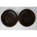 2 bronze wall plaques depicting dogs