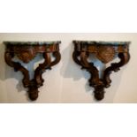 2 wooden carved consoles with green marble top