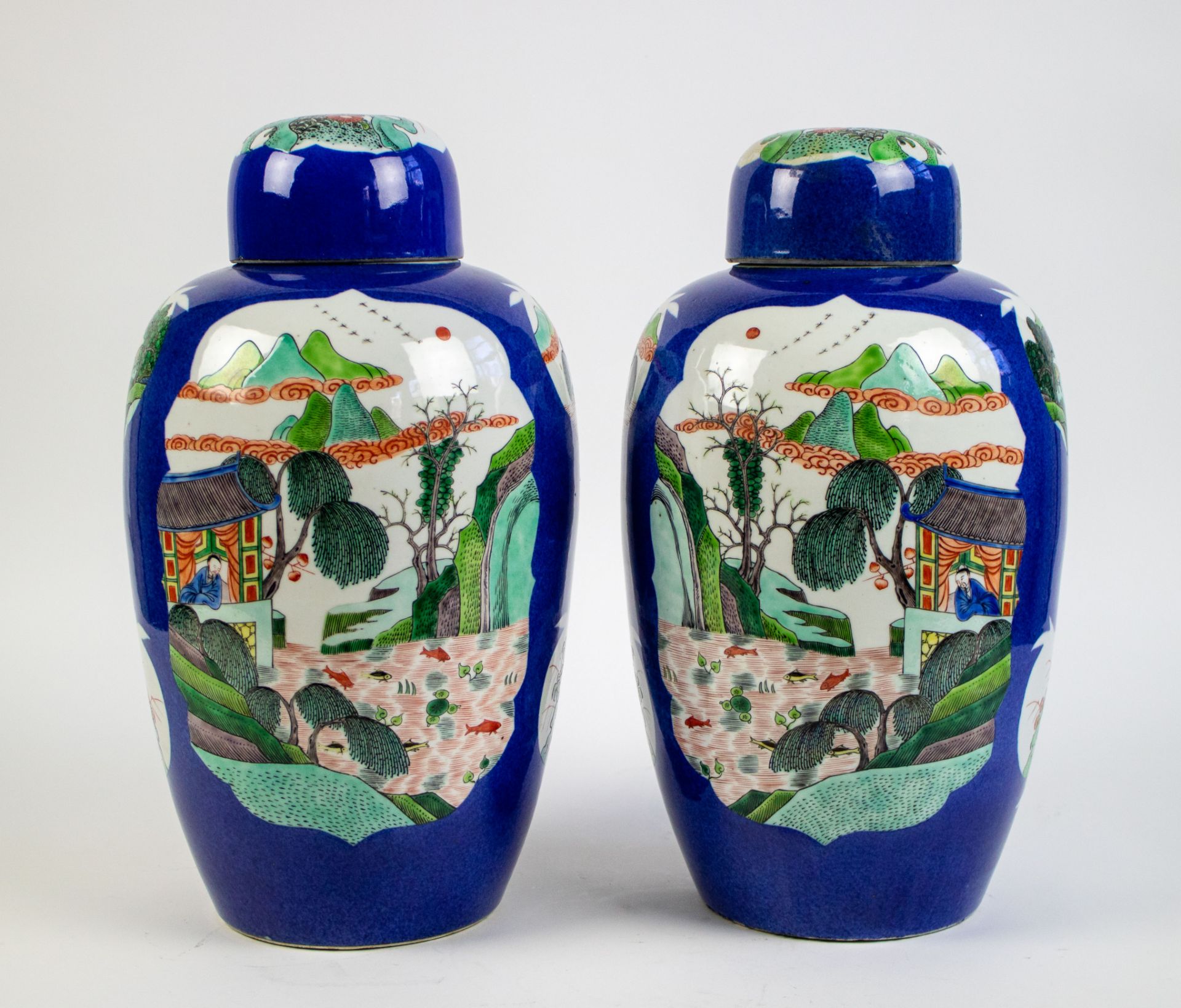 A pair of Kangxi lidded vases