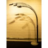 A large vintage chromed arc floor lamp with six overhanging arms