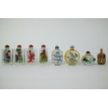 A collection of 8 snuf bottles