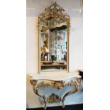 A Rococo style console with mirror