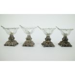 A collection of 4 silver & cristal salt houders