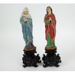 A pair of wooden holy figures