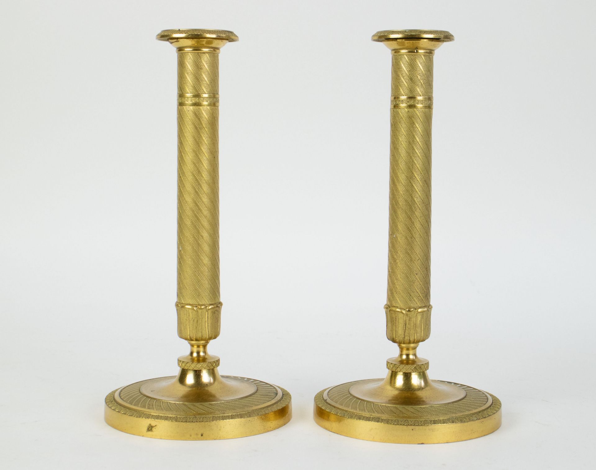 A pair of Empire candlesticks