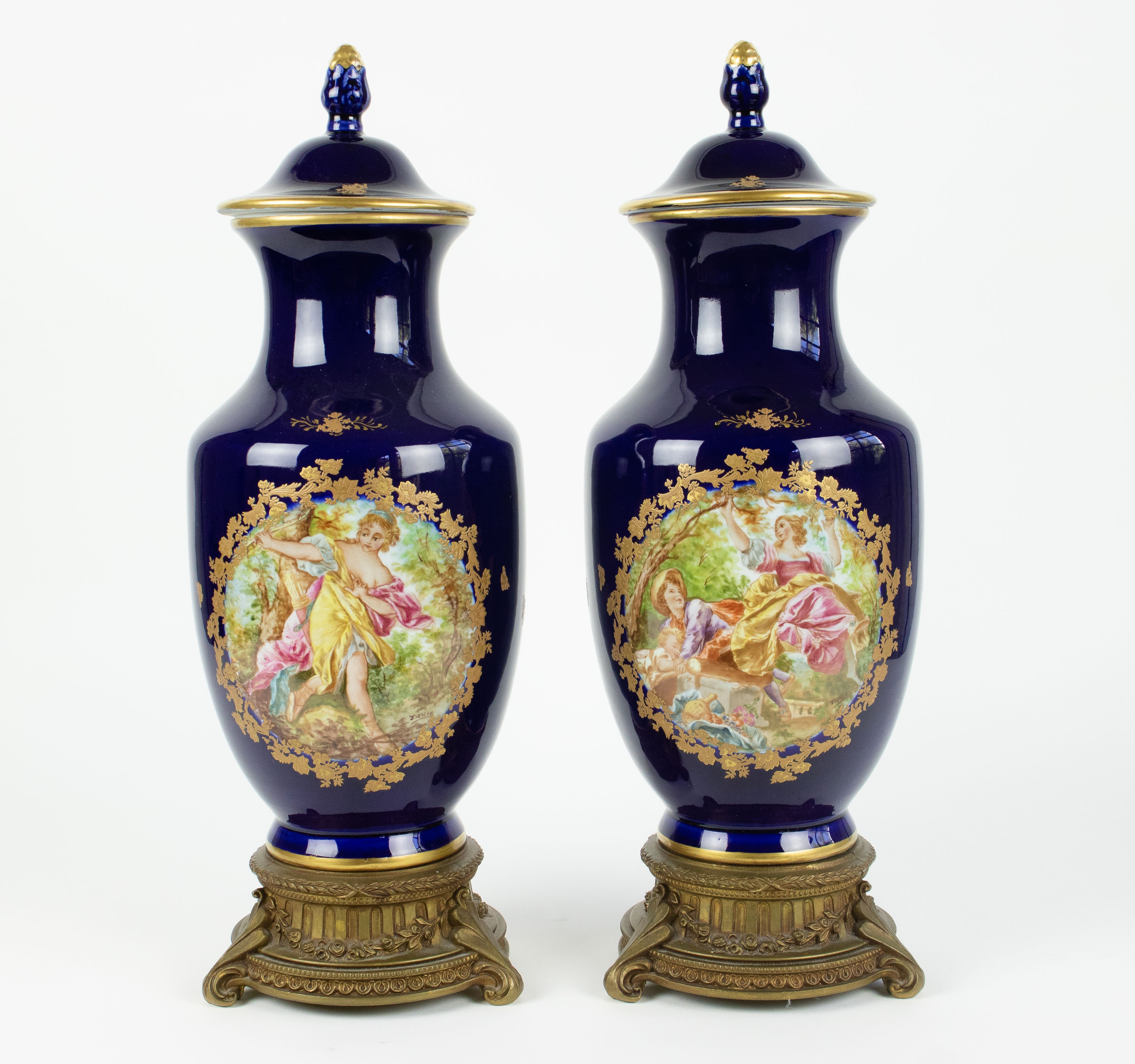 A pair of handpainted Sèvres style vases