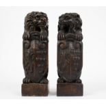 A pair of wooden lions
