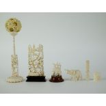 A collection of carved ivory items