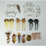 A collection of Art Nouveau hair pins and old glasses