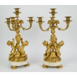 Gilt bronze Louis XVI candlesticks on marble feet