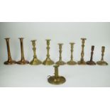 A collection of 10 copper candlesticks