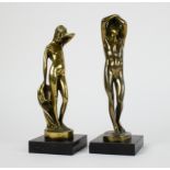 Male and female bronze figures