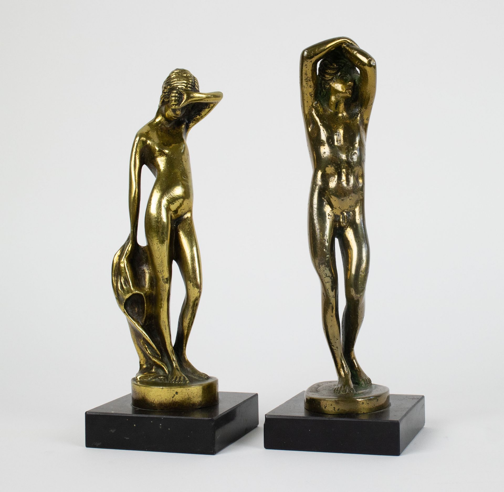 Male and female bronze figures