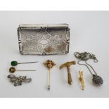 A silver box with vermeil and ornamental jewelery