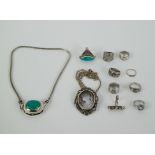 A collection of ornamental silver jewelery