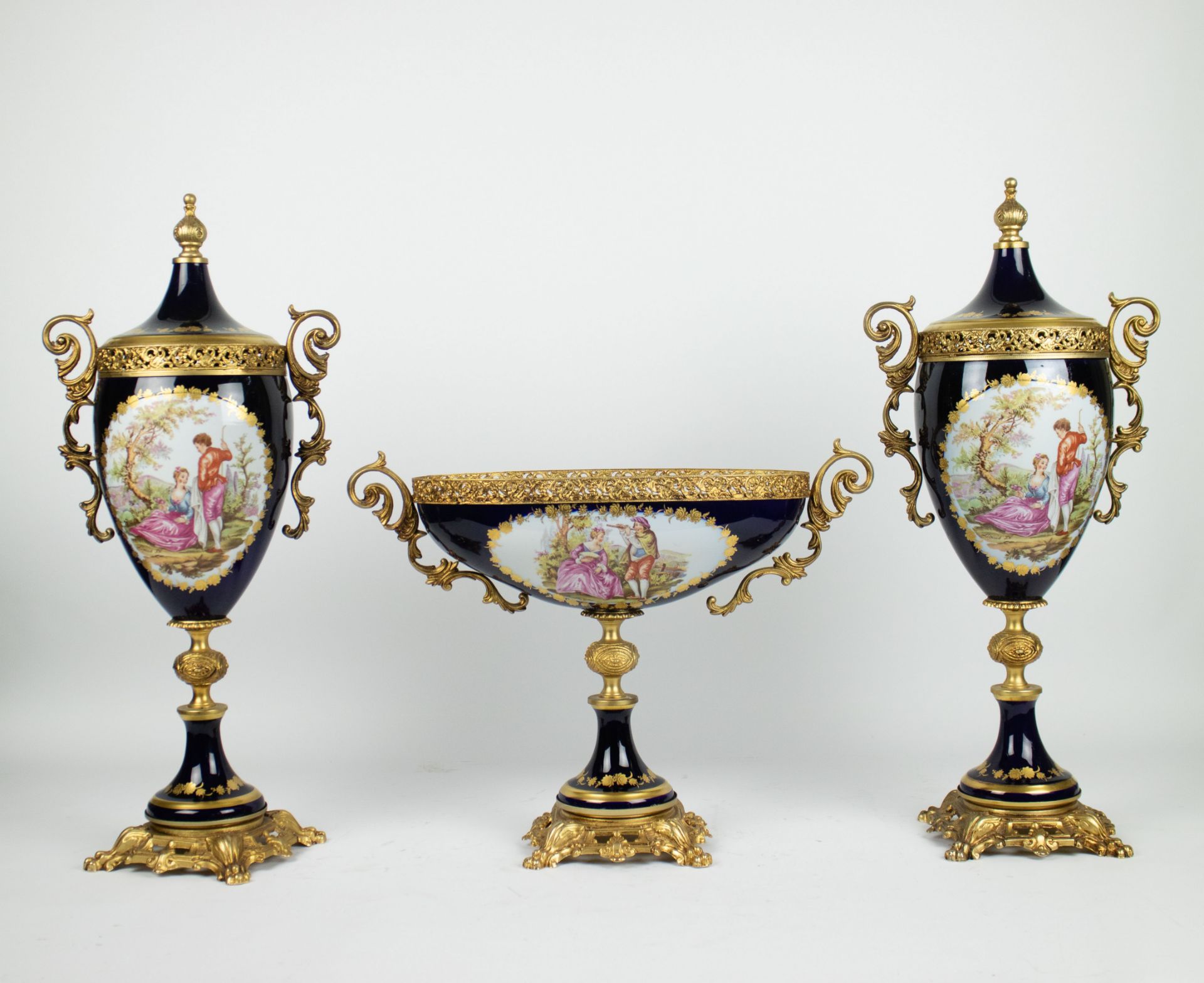 Sèvres garniture centre piece and a pair of covered vases