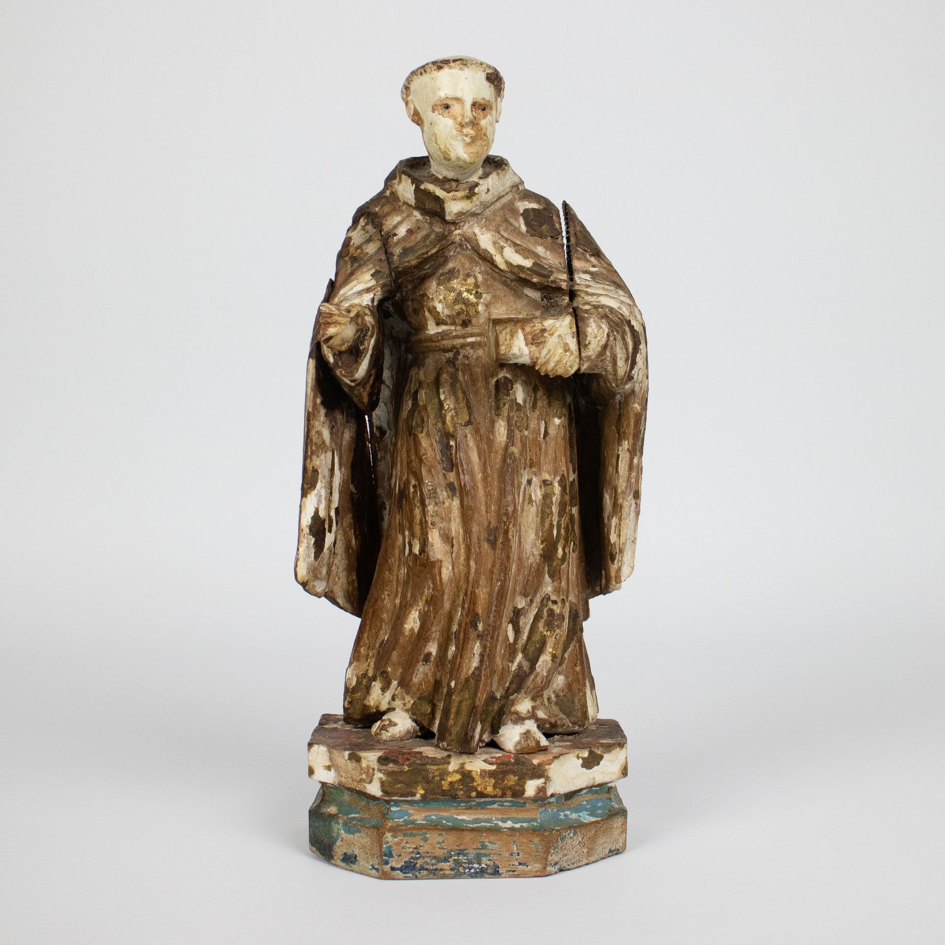 A wooden holy figure with polychromy