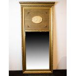 Decorated mirror with integrated medallion