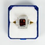 Ring white gold 18 carat, brilliant cut and garnet stone