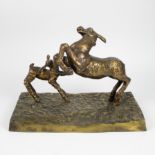 A polished bronze sculpture of 2 deer