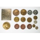 A collection of medals and tokens from historical figures and events, including silver 1858