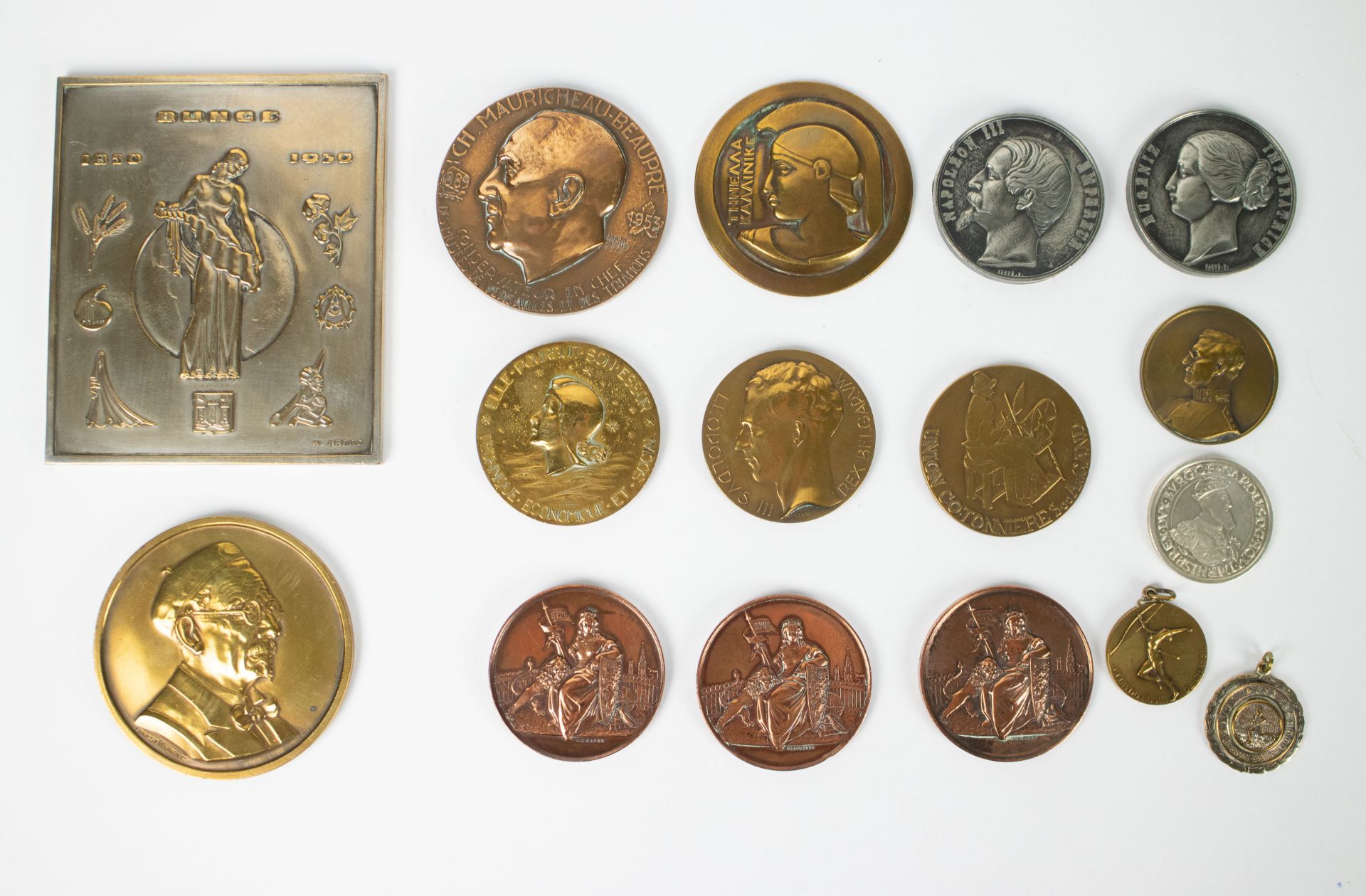 A collection of medals and tokens from historical figures and events, including silver 1858