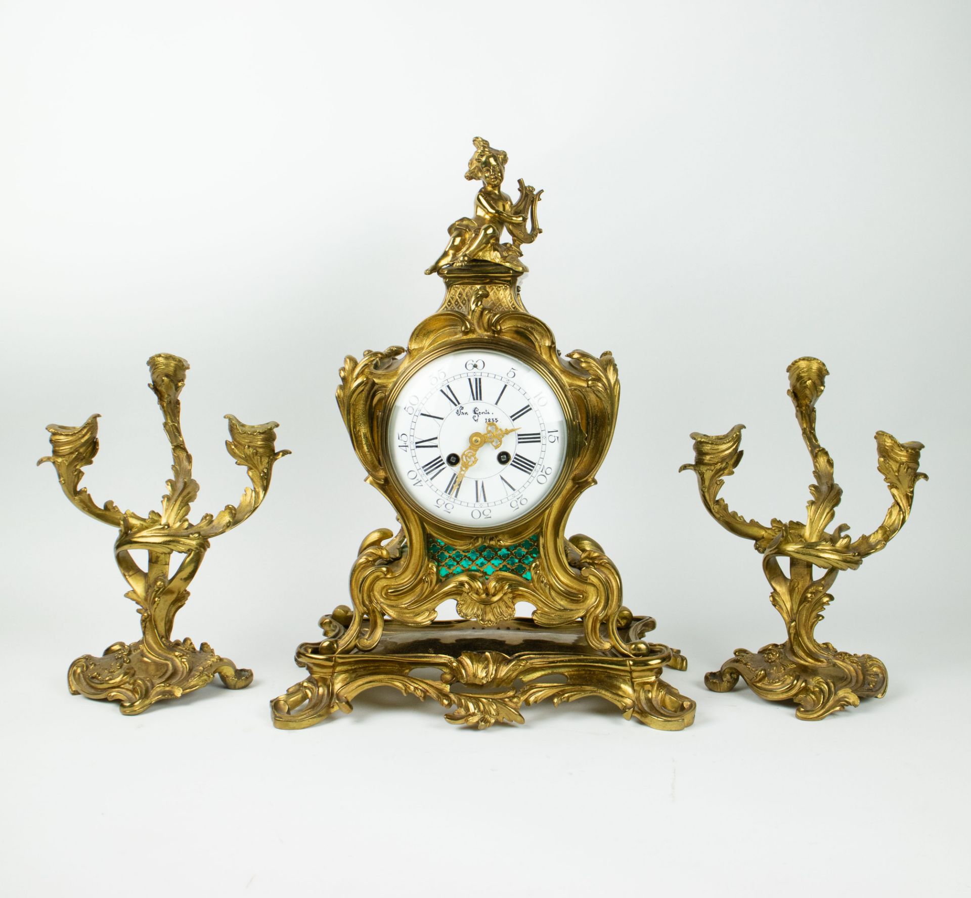 Pendulum and 2 candlesticks in bronze doré, signed in the dial Van Gent 1855