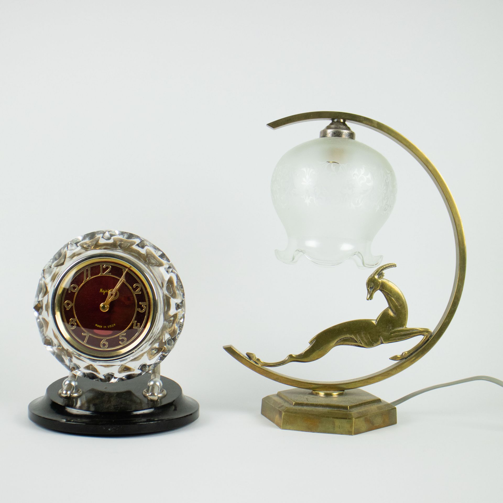 An Art Deco lampadaire with antelope and a Russian alarm clock (USSR)