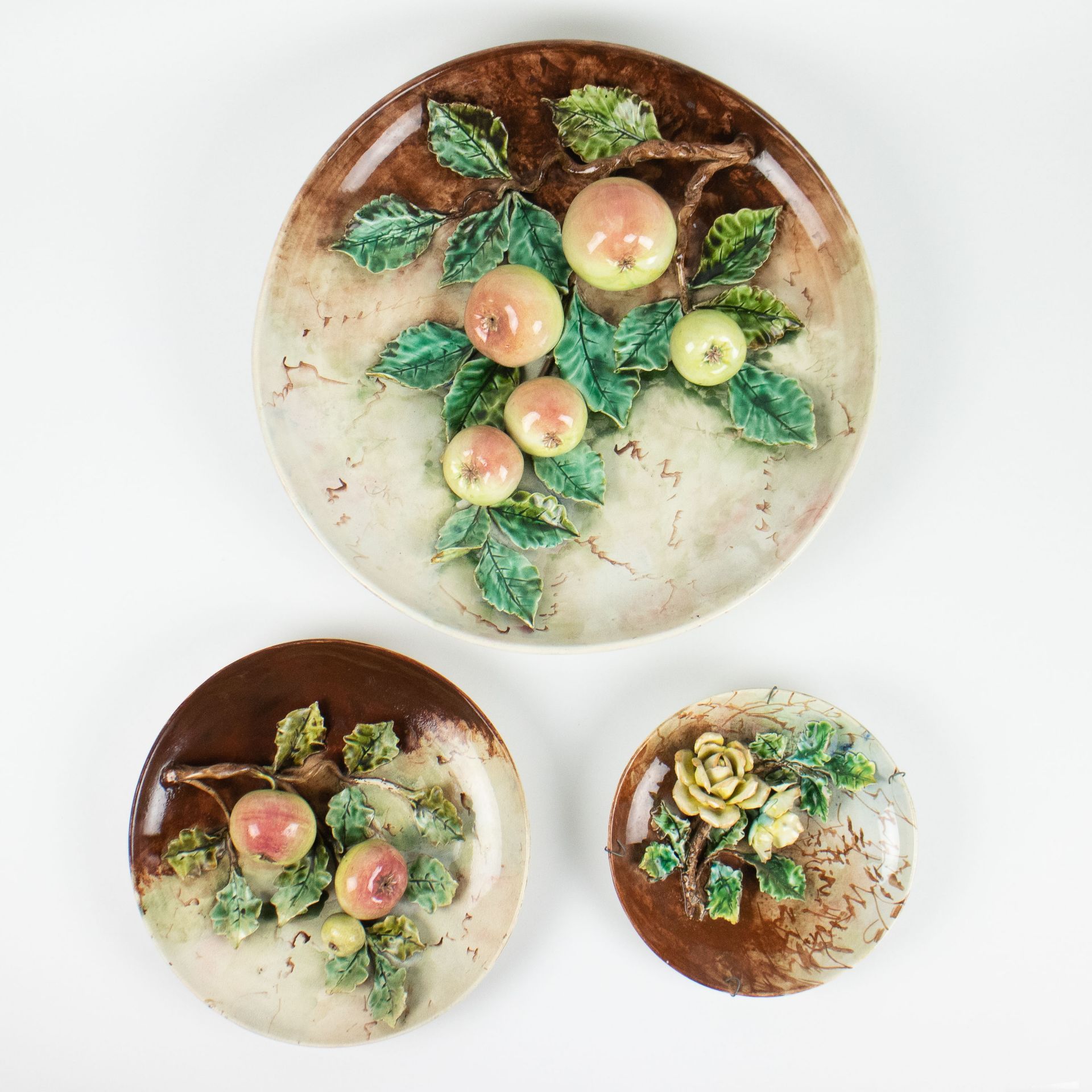 LONGCHAMP: 3 earthenware dishes with decoration apples, leaves and flowers in high relief